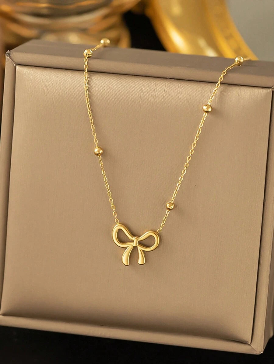 GOLD BOW NECKLACE